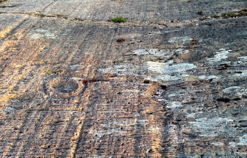 Heavily weathered motifs on Derreenaclogh 2 