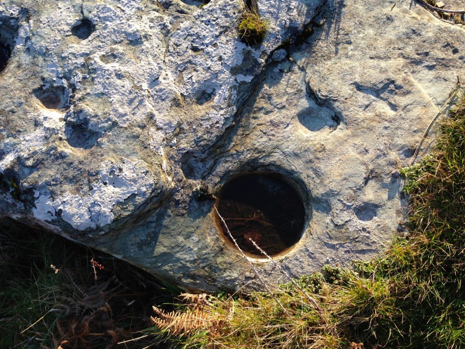 Look for the possible cross carving on the right