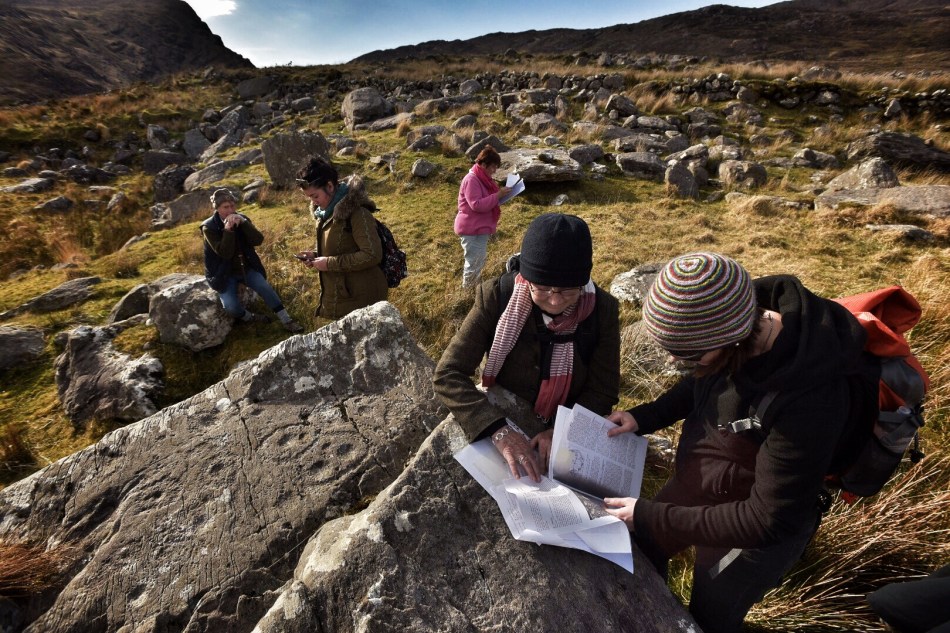 Robert, Clare, Finola, Elizabeth and Avril, checking the records and GPS readings. (Photo © Ken Williams)