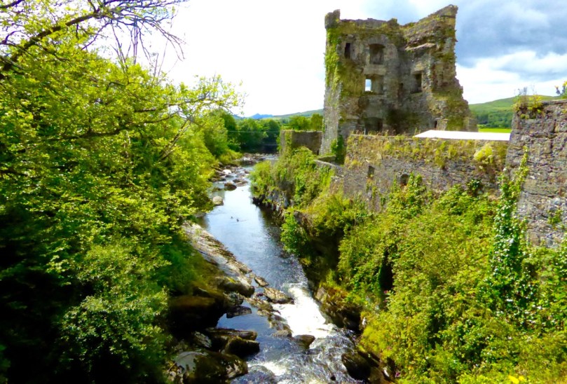 The bawn wall of Carriganass Castle at Kealkill hovers picturesquely over the river