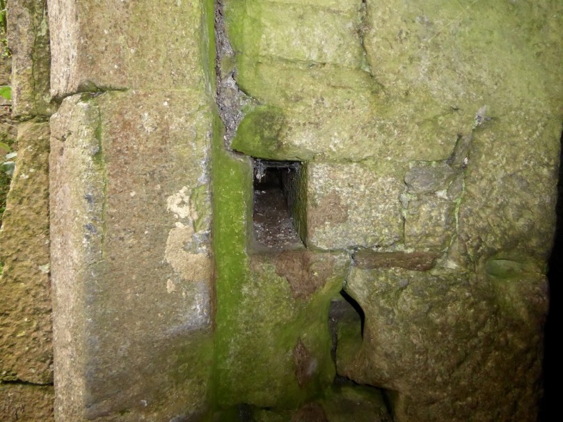 Look for a bar-hole behind the main door